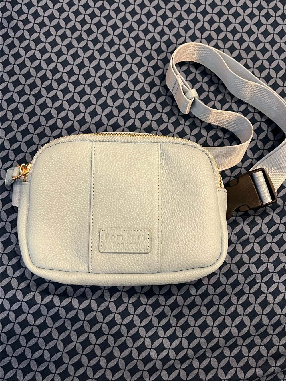 Baby blue pompom London leather